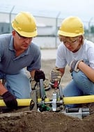 man-and-woman-installing-gas-fuel-line
